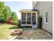 A stone patio with an outdoor fire pit sits in the backyard at 622 Rocky Creek Pt, Woodstock, GA 30188