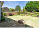 Landscaped backyard with an outdoor fire pit at 622 Rocky Creek Pt, Woodstock, GA 30188