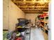 Unfinished basement with exposed beams, concrete walls, and shelving units at 622 Rocky Creek Pt, Woodstock, GA 30188