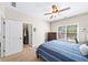 Charming bedroom with neutral walls, carpet, and a window, featuring a large closet and full dresser at 622 Rocky Creek Pt, Woodstock, GA 30188