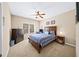 Inviting bedroom with neutral walls, carpet, and a window, accompanied by a full dresser and a nightstand at 622 Rocky Creek Pt, Woodstock, GA 30188