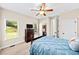 Inviting bedroom features large window with natural light and ceiling fan at 622 Rocky Creek Pt, Woodstock, GA 30188