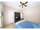Cozy bedroom with neutral walls, carpet, and a window, featuring a full length dresser and closet at 622 Rocky Creek Pt, Woodstock, GA 30188
