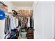 Organized walk-in closet with ample storage space for clothes and other belongings at 622 Rocky Creek Pt, Woodstock, GA 30188