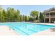 Large community pool with an attached structure and staircase at 622 Rocky Creek Pt, Woodstock, GA 30188