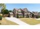 Attractive two-story home with a long driveway and meticulously maintained landscaping at 622 Rocky Creek Pt, Woodstock, GA 30188