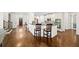 View from the living room into the kitchen with an island and bar seating at 622 Rocky Creek Pt, Woodstock, GA 30188