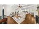 Open-concept living room with hardwood floors and views to the kitchen and dining area at 622 Rocky Creek Pt, Woodstock, GA 30188