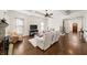 Bright living room with coffered ceiling, hardwood floors, fireplace, and open floor plan at 622 Rocky Creek Pt, Woodstock, GA 30188