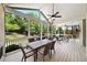 Relaxing screened-in porch with views of the landscaped backyard at 622 Rocky Creek Pt, Woodstock, GA 30188