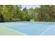 Close up view of Community tennis courts, enclosed by a fence at 622 Rocky Creek Pt, Woodstock, GA 30188