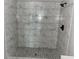 Contemporary bathroom with marbled tile shower featuring matte black fixtures and a built-in niche at 8977 Teal Ln, Jonesboro, GA 30236