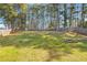 Spacious, green backyard with a sturdy wooden fence, offering privacy and a sense of tranquility at 105 Glenmore Ln, Mcdonough, GA 30253