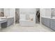Spacious bathroom with soaking tub, dual vanities, and access to walk-in closets at 105 Glenmore Ln, Mcdonough, GA 30253