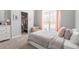 Bedroom featuring a large window with pink curtains, plush carpeting and a closet at 105 Glenmore Ln, Mcdonough, GA 30253
