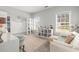 Bright bedroom with plush seating, lots of shelving and natural light from the large windows at 105 Glenmore Ln, Mcdonough, GA 30253