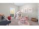 Cozy bedroom with light walls, carpet flooring, and a play house for  at 105 Glenmore Ln, Mcdonough, GA 30253