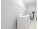 Bright laundry room featuring white tile flooring, shelving and modern washer and dryer units at 105 Glenmore Ln, Mcdonough, GA 30253