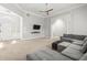 Airy living room with plush seating, high ceilings, neutral tones, and an open entryway to the rest of the home at 105 Glenmore Ln, Mcdonough, GA 30253