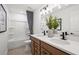 This bathroom features dual sinks, a tub with shower, and a decorative mirror at 1636 Tide Mill Rd, Cumming, GA 30040