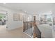 This hallway with railing and artwork offers views to other rooms at 1636 Tide Mill Rd, Cumming, GA 30040