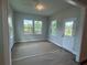 Bright sunroom with ample natural light, offering a serene space with views of the backyard at 1636 Tide Mill Rd, Cumming, GA 30040