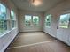 Bright sunroom with large windows offering backyard views at 1636 Tide Mill Rd, Cumming, GA 30040