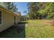 Spacious backyard features a patio area and mature trees, perfect for outdoor entertaining at 6520 Emerald Pointe Cir, Atlanta, GA 30349