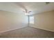 Bedroom with neutral carpet, ceiling fan, and natural light at 6520 Emerald Pointe Cir, Atlanta, GA 30349