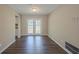 Bright dining area featuring hardwood floors and french doors at 6520 Emerald Pointe Cir, Atlanta, GA 30349