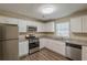 Updated kitchen with stainless steel appliances, granite countertops, and ample storage at 6520 Emerald Pointe Cir, Atlanta, GA 30349