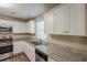 Modern kitchen with stainless steel appliances, granite countertops, and lots of storage at 6520 Emerald Pointe Cir, Atlanta, GA 30349