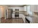Spacious kitchen with stainless steel appliances, granite countertops, and modern finishes at 6520 Emerald Pointe Cir, Atlanta, GA 30349
