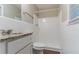 Bright bathroom with white tile, modern fixtures, and a shower at 8596 Timberlane Dr, Douglasville, GA 30134
