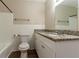 Bathroom with white tile, granite countertop, and modern fixtures at 8596 Timberlane Dr, Douglasville, GA 30134