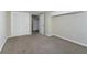 Bedroom featuring carpeted floors, bi-fold closet doors, a single light fixture, and painted walls at 8596 Timberlane Dr, Douglasville, GA 30134