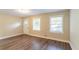 Spacious living room showcasing modern flooring, natural light, and a neutral color palette for versatile décor options at 8596 Timberlane Dr, Douglasville, GA 30134