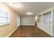 A bright and airy living area featuring wood-look floors, neutral tones, and ample natural light, creating a cozy atmosphere at 8596 Timberlane Dr, Douglasville, GA 30134