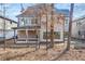 A backyard view of the house with gray siding, a covered patio, and a freshly seeded lawn at 909 Sunny Meadows Lane, Marietta, GA 30062