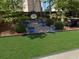 Backyard features a brick path leading to an egg chair, with colorful potted plants and well-manicured landscaping at 909 Sunny Meadows Lane, Marietta, GA 30062