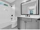 Modern bathroom with gray vanity, black fixtures, subway tile, and a large mirror at 909 Sunny Meadows Lane, Marietta, GA 30062