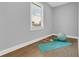 Small bedroom with wood flooring, window, and exercise equipment at 909 Sunny Meadows Lane, Marietta, GA 30062