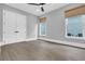 This bedroom features hardwood floors, double doors, and recessed lighting for a cozy and modern feel at 909 Sunny Meadows Lane, Marietta, GA 30062