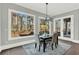 Bright dining area with a modern light fixture with natural light and backyard views at 909 Sunny Meadows Lane, Marietta, GA 30062