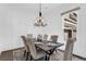 Elegant dining room with wainscoting and modern chandelier perfect for dinner parties at 909 Sunny Meadows Lane, Marietta, GA 30062