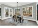 Dining area with backyard views from the windows and doors enhancing the dining ambiance at 909 Sunny Meadows Lane, Marietta, GA 30062