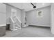 Well-lit garage interior featuring finished concrete floors, steps to the main house, and an exterior door at 909 Sunny Meadows Lane, Marietta, GA 30062
