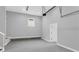 Spacious garage interior featuring clean concrete floors, bright lighting, and a door to the main house at 909 Sunny Meadows Lane, Marietta, GA 30062