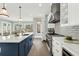 Spacious kitchen with a large island, stainless steel appliances, and a view to the dining area at 909 Sunny Meadows Lane, Marietta, GA 30062