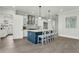 Charming kitchen featuring a large island with seating, stainless steel appliances, and modern lighting at 909 Sunny Meadows Lane, Marietta, GA 30062